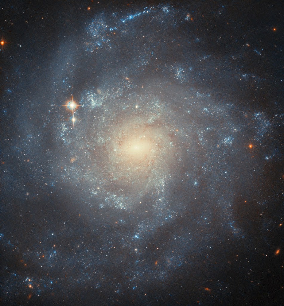 Hubble Captures Spiraling Mystery in Galaxy NGC 5668.